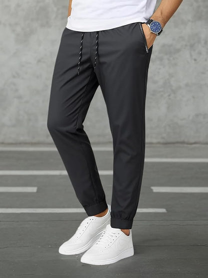 Pantalon de sport pour homme avec taille élastique et poches zippées pour la course à pied et la randonnée
Taille: L