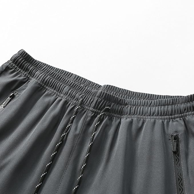 Pantalon de sport pour homme avec taille élastique et poches zippées pour la course à pied et la randonnée
Taille: L